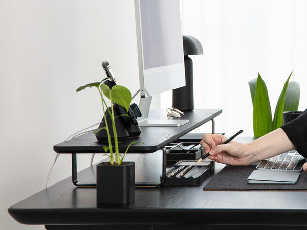 side view of black wooden desk shelf with standing desk setup | black, 